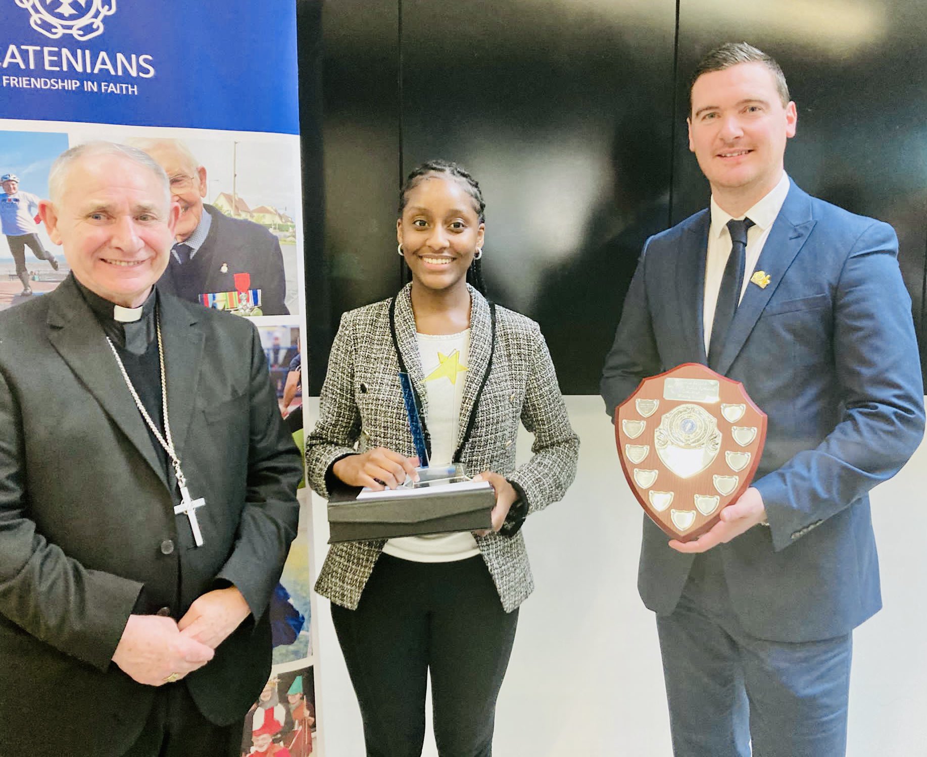 image showing Cynthia receiving her trophy at the Catenian Speaking Competition